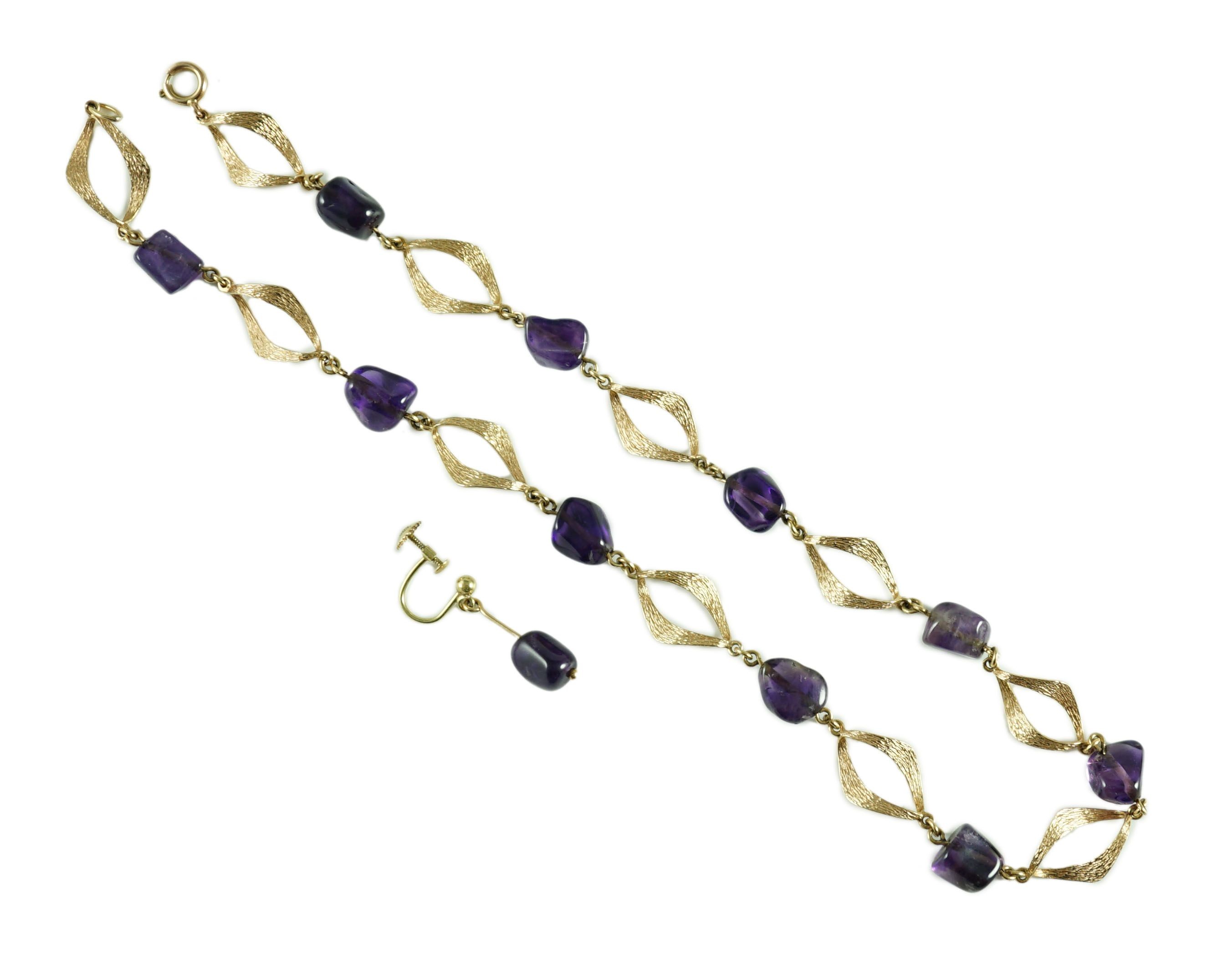 A modern textured 14ct gold and amethyst pebble set necklace and a pair of similar earrings